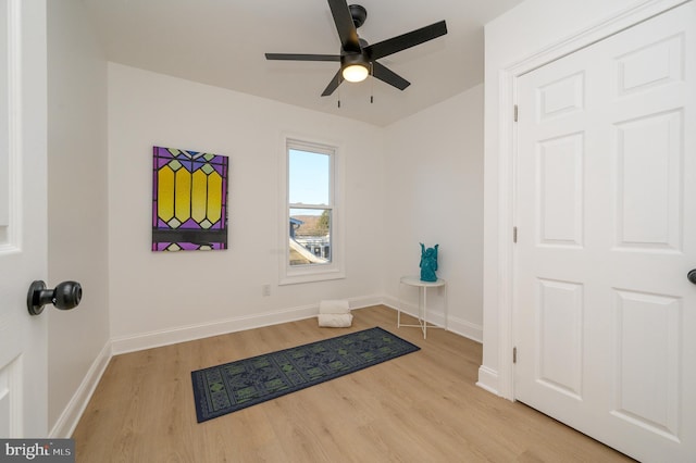 interior space with ceiling fan and light hardwood / wood-style floors