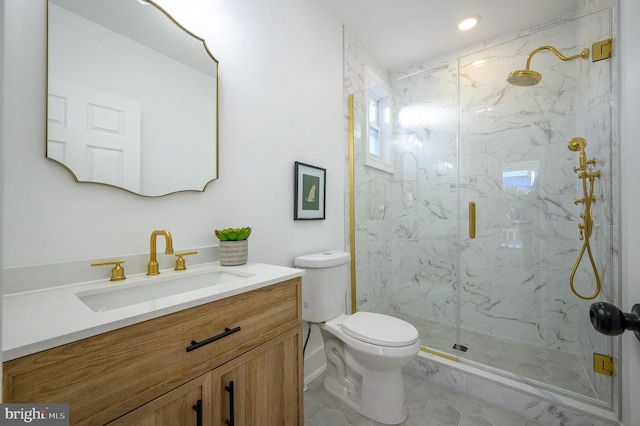 bathroom with tile patterned flooring, vanity, toilet, and a shower with shower door