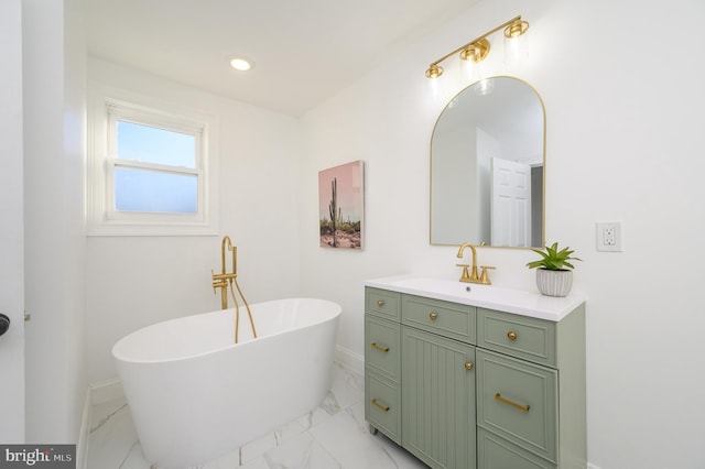 bathroom with a washtub and vanity