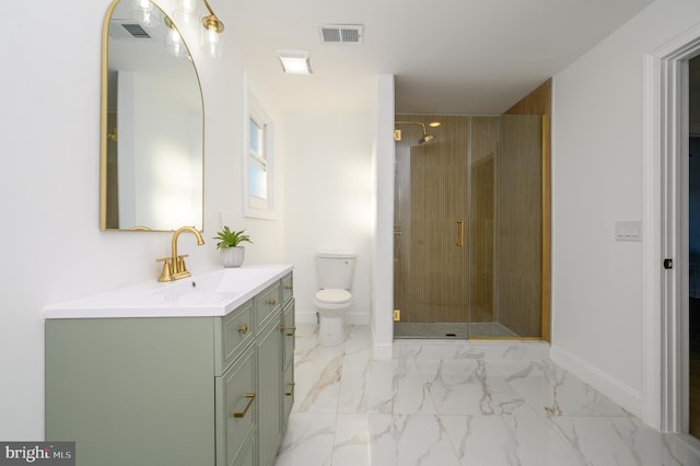 bathroom featuring vanity, toilet, and a shower with shower door