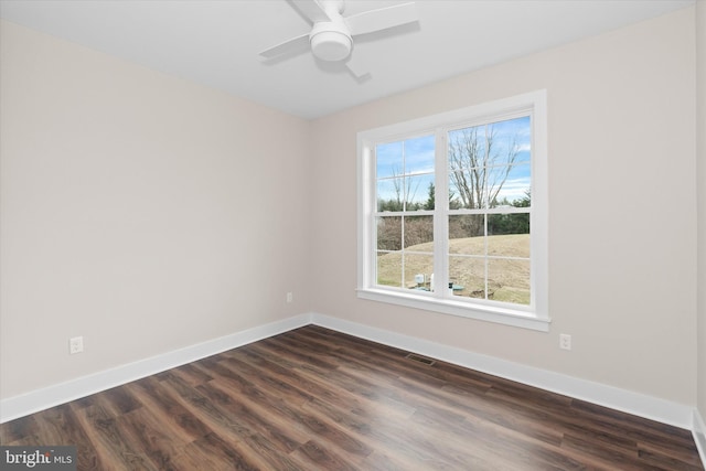 interior space featuring ceiling fan, a healthy amount of sunlight, and dark hardwood / wood-style flooring