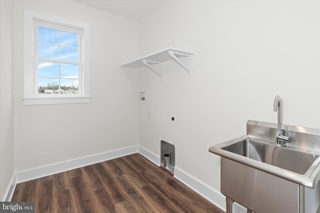 laundry area with electric dryer hookup, dark hardwood / wood-style flooring, sink, and washer hookup