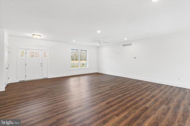 interior space featuring ceiling fan and dark wood-type flooring