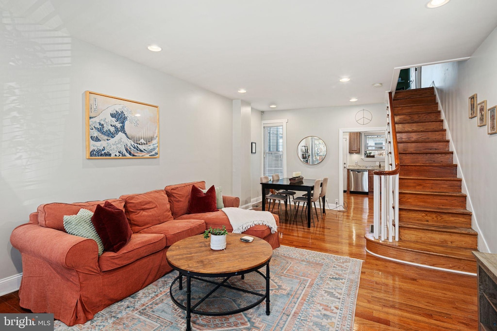 living room with light hardwood / wood-style flooring