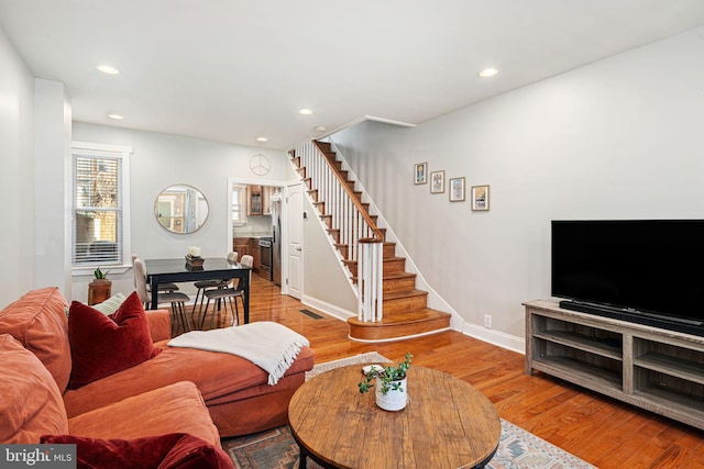 living room with light hardwood / wood-style floors