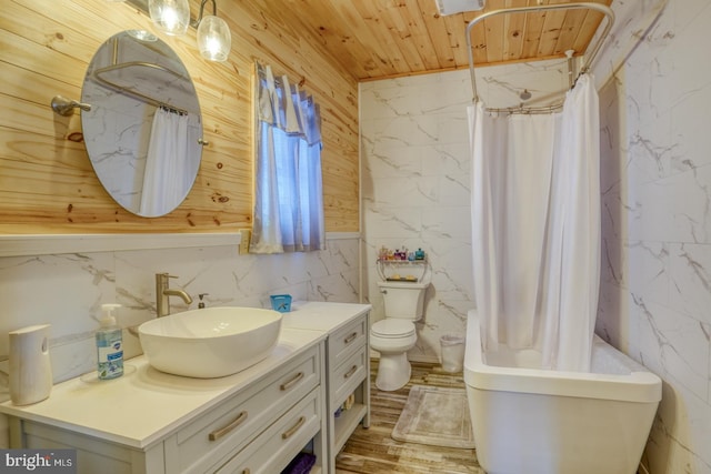 bathroom with vanity, wood ceiling, and toilet