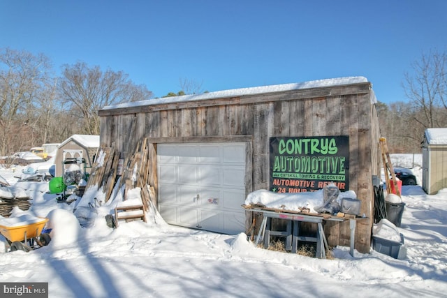 view of snow covered garage