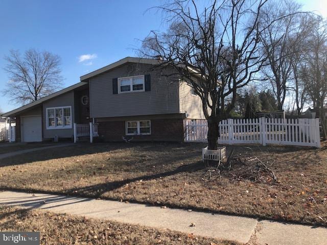 split level home featuring a garage