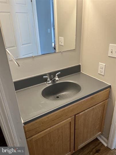 bathroom featuring wood-type flooring and vanity