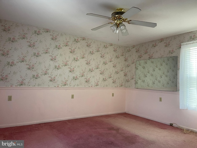 unfurnished room featuring carpet floors and ceiling fan