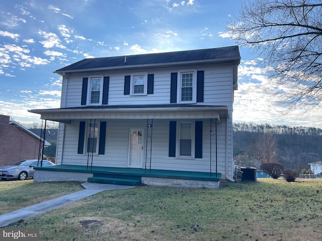 view of front of home featuring central air condition unit, a porch, and a front yard