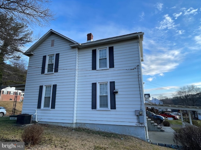 view of side of home with cooling unit