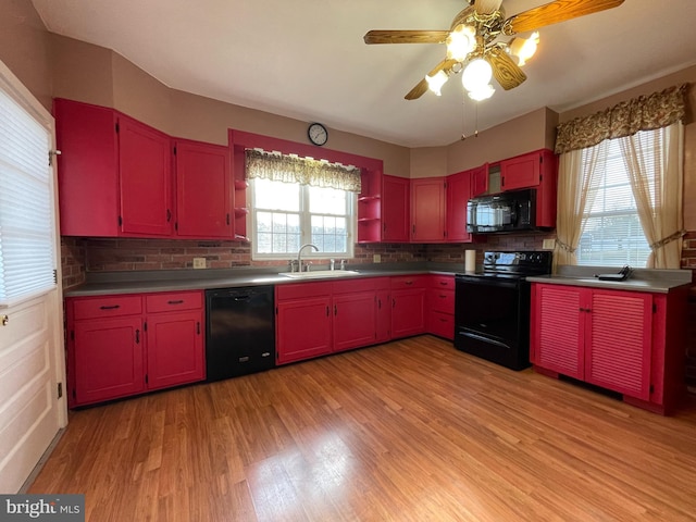 kitchen featuring black appliances, sink, ceiling fan, decorative backsplash, and light hardwood / wood-style floors