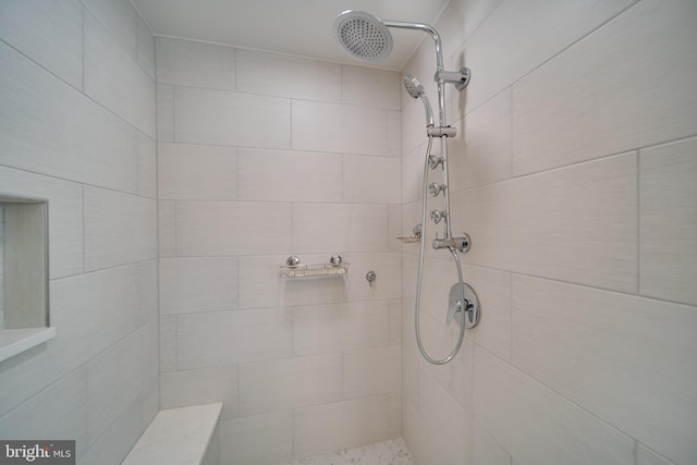 bathroom featuring tiled shower