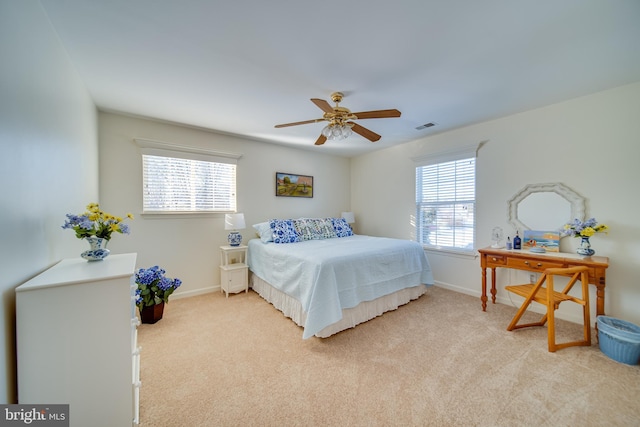 bedroom featuring ceiling fan and light carpet