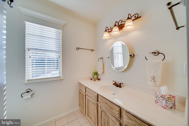 bathroom featuring tile patterned flooring and vanity