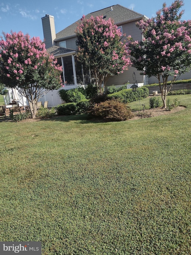 view of yard with a sunroom