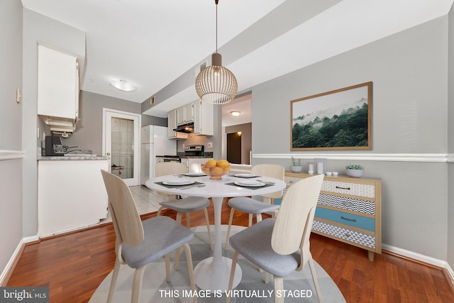 dining room featuring dark hardwood / wood-style flooring