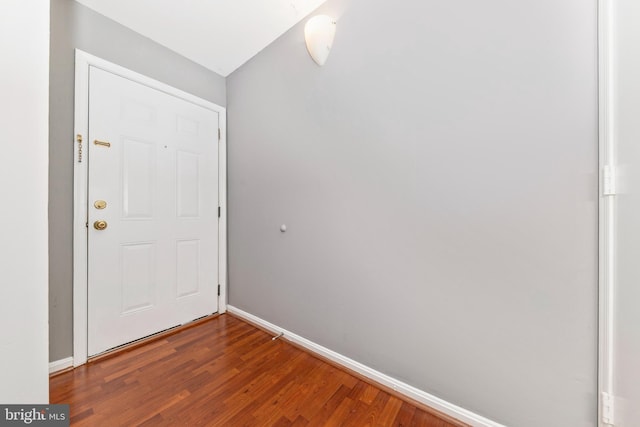 doorway featuring dark wood-type flooring