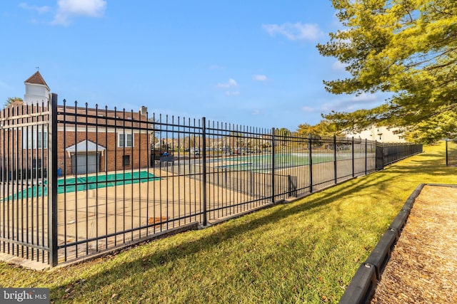 view of swimming pool with a yard and a patio