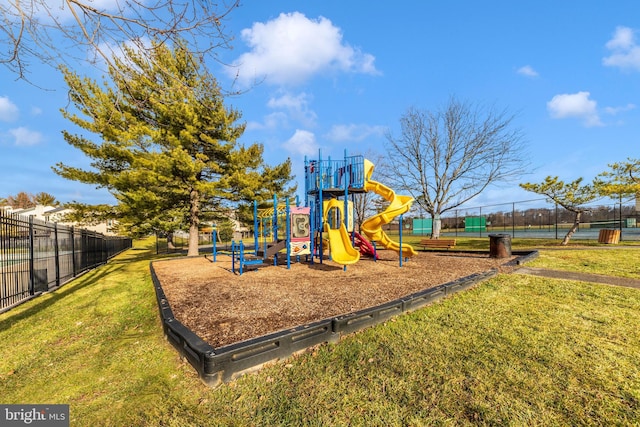 view of playground with a water view and a yard