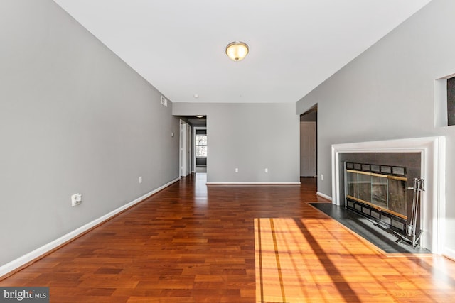 unfurnished living room featuring hardwood / wood-style flooring