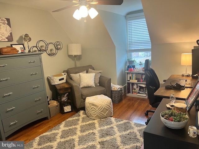 office featuring dark hardwood / wood-style flooring, ceiling fan, and vaulted ceiling