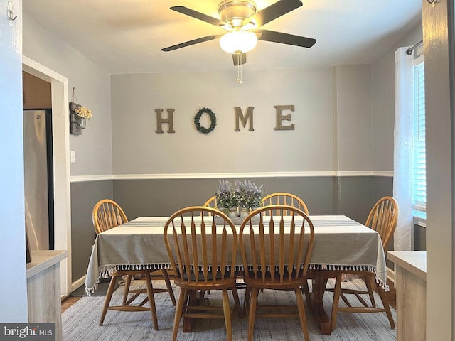 dining space featuring hardwood / wood-style flooring and ceiling fan