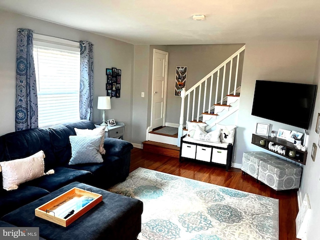 living room with dark hardwood / wood-style flooring