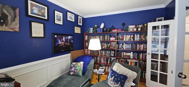 living area with crown molding