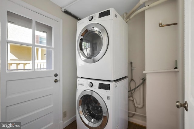 laundry room featuring stacked washer and dryer