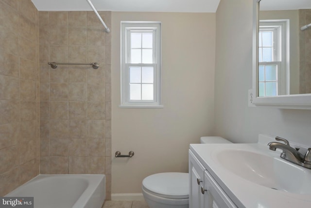 full bathroom with vanity, toilet, and tiled shower / bath