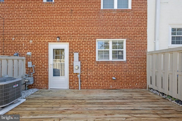 wooden terrace featuring central AC unit