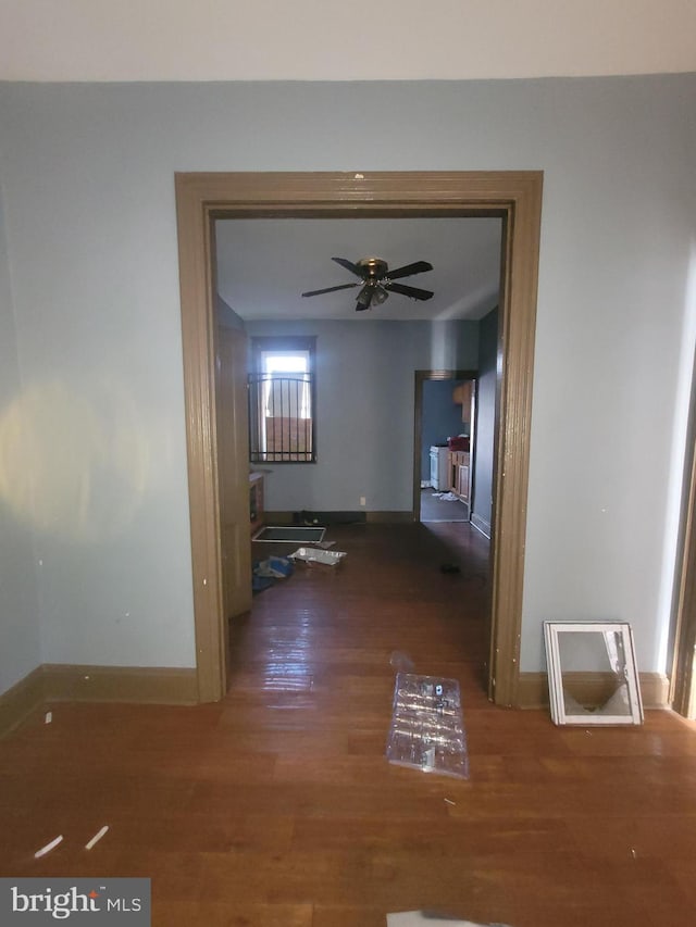 corridor featuring dark hardwood / wood-style floors