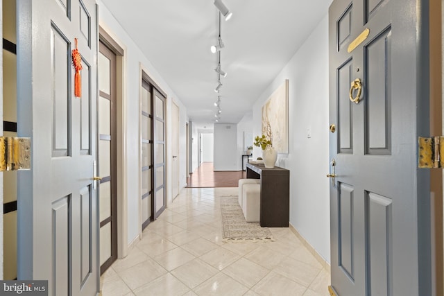 corridor featuring light tile patterned floors