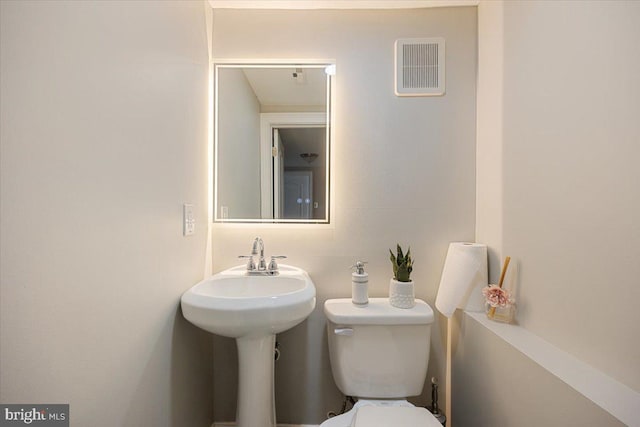 bathroom featuring toilet