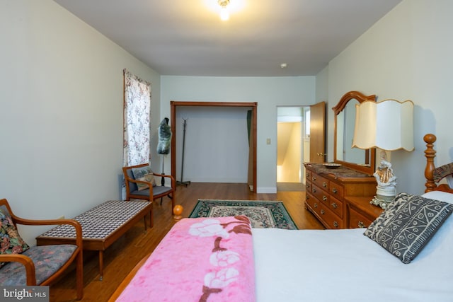 bedroom with wood finished floors