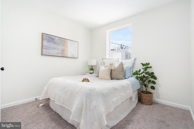 bedroom featuring light carpet