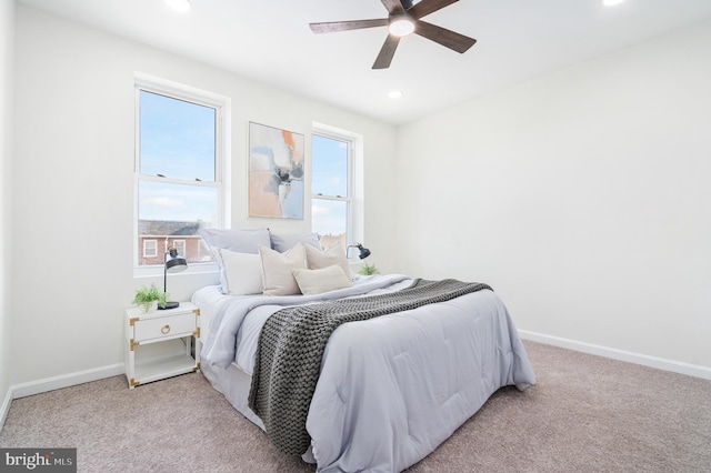 carpeted bedroom with ceiling fan