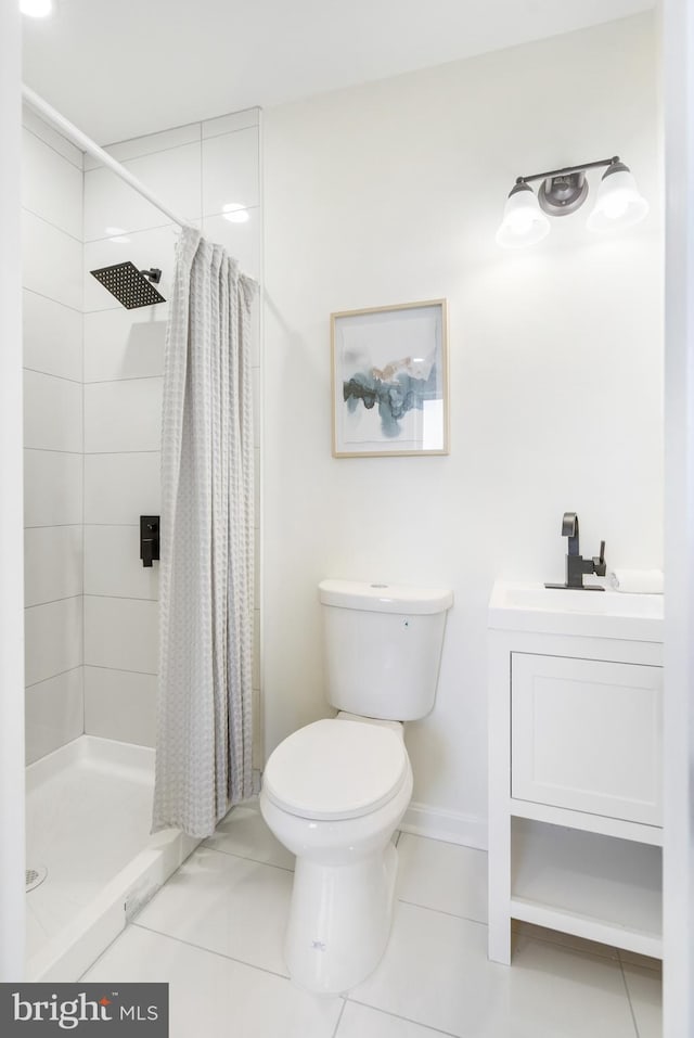 bathroom with tile patterned flooring, vanity, toilet, and curtained shower