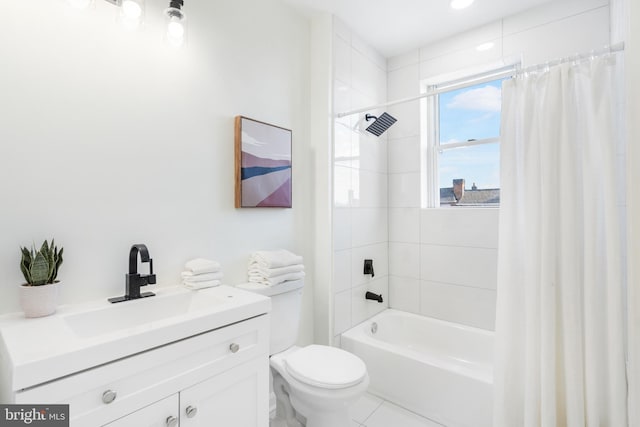 full bathroom featuring tile patterned floors, vanity, toilet, and shower / tub combo