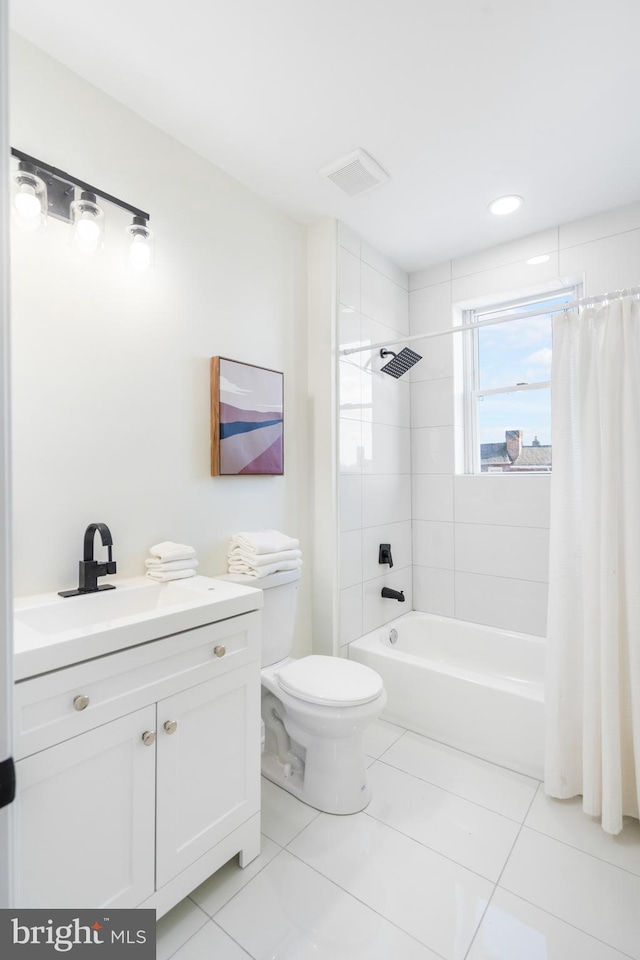 full bathroom featuring toilet, shower / bath combination with curtain, vanity, and tile patterned floors