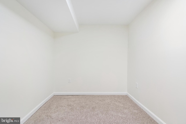 empty room with light colored carpet