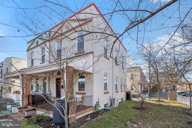 view of front of house featuring a front yard and covered porch