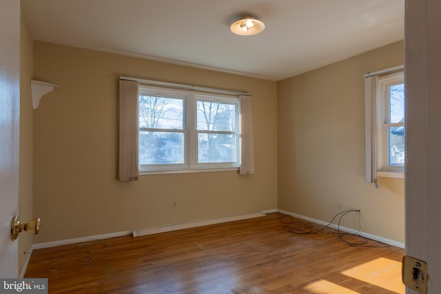 unfurnished room featuring light wood-type flooring