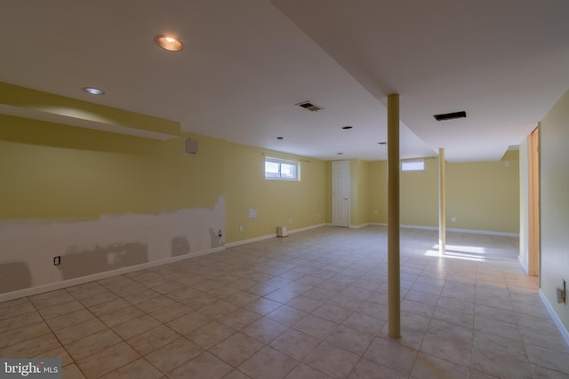 basement featuring light tile patterned floors