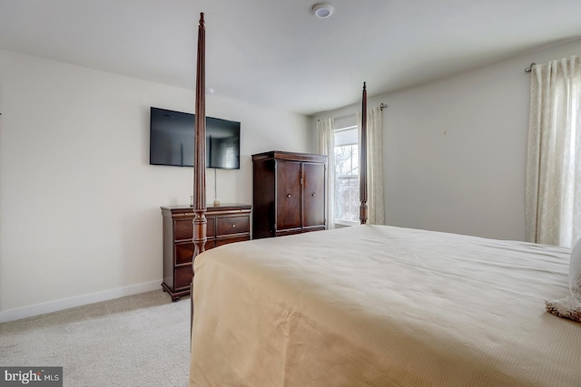 bedroom featuring light carpet