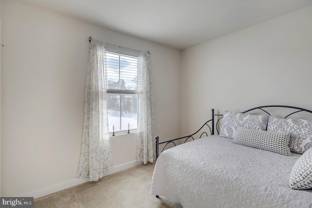 bedroom with light carpet