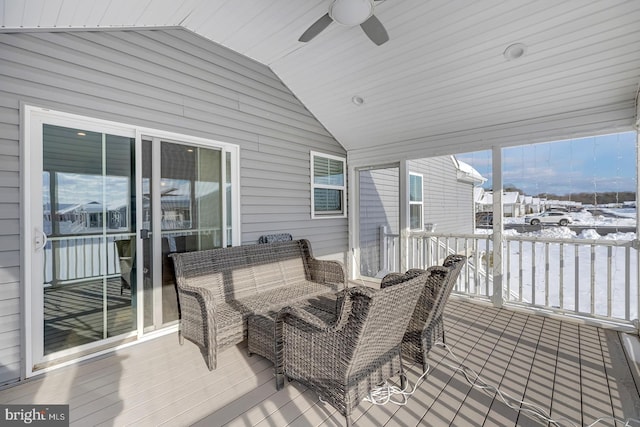 snow covered deck with ceiling fan and an outdoor hangout area