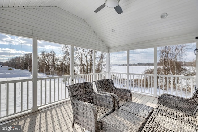 sunroom / solarium with ceiling fan and lofted ceiling